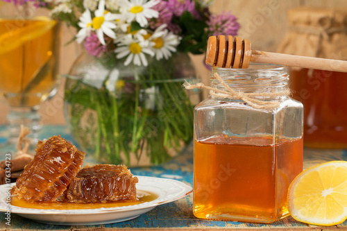 Honey in a pot or jar on kitchen table