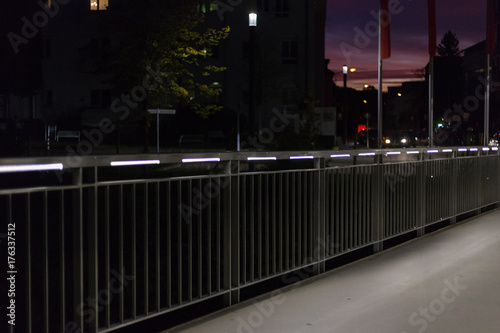 pedestrian bridge at night in south german city near stuttgart with led lights