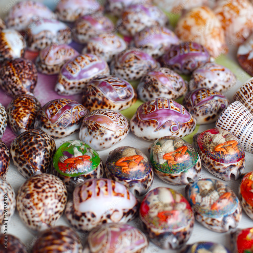 seashells for sale on a beach in Bali to attract tourists looking for a souvenir of their tropical summer vacation