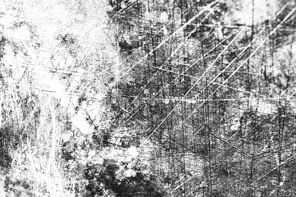 Grunge black and white abstract background or texture with distress scratch.