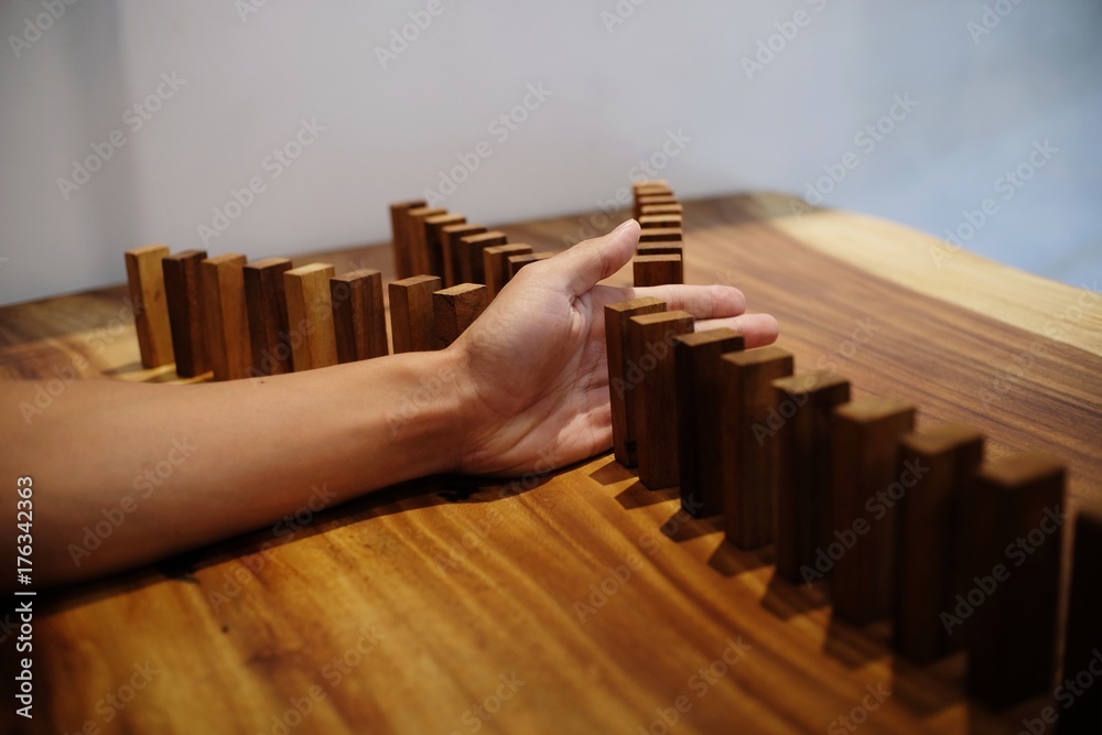 Planning risk and strategy in businessman gambling placing wooden block.Business concept for growth success process