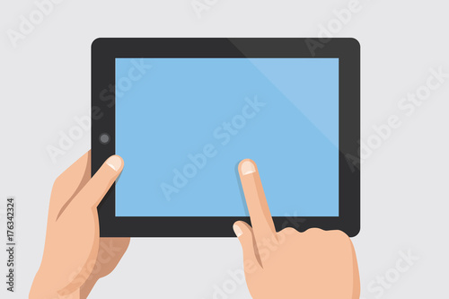 Finger touching blank screen of tablet computer photo