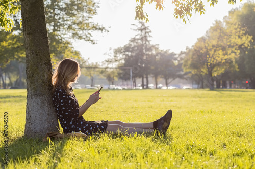 Woman portrait at summer sunset at the park in Verona photo