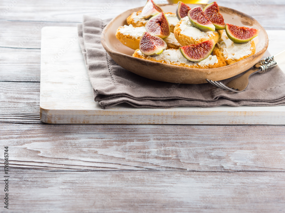 Crostini with cheese and figs. Light sweet and savory snack with wine Crostini with cheese and figs. Light sweet and savory snack with wine