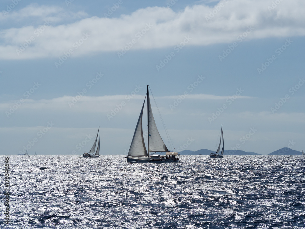 Fototapeta premium Sailing yacht in Croaatia, windy summer on the boat between rocky islands of the Mediterranean sea