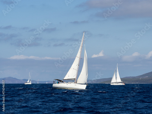 Fototapeta Naklejka Na Ścianę i Meble -  Sailing yacht in Croaatia, windy summer on the boat between rocky islands of the Mediterranean sea