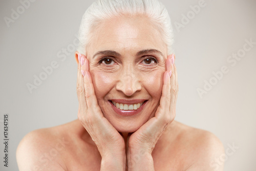 Amazing naked elderly woman posing