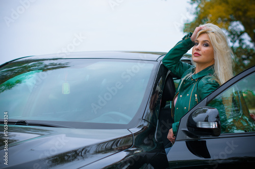 Pretty blonde hair woman on a road in automobile. Woman and car, accident in a trip  © T.Den_Team