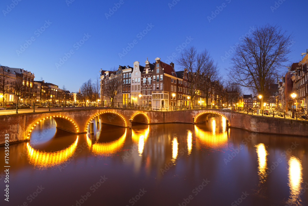 Bridges over canals in Amsterdam at night