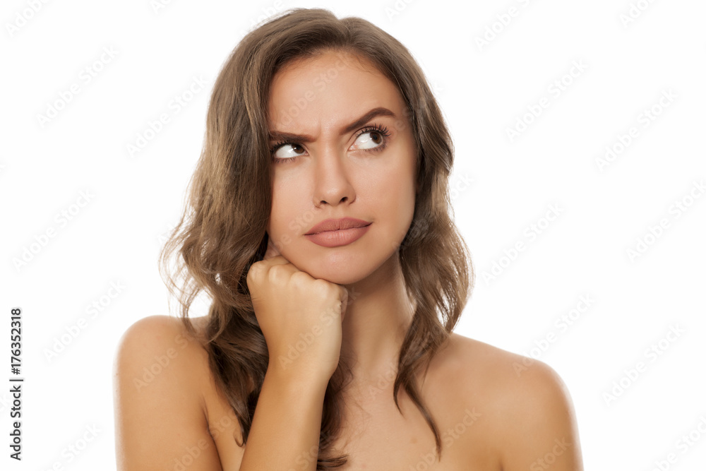 Portrait of beautiful young thinking woman on white background Portrait of beautiful young thinking woman on white background