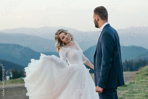 A beautiful couple of brides walking outside photo