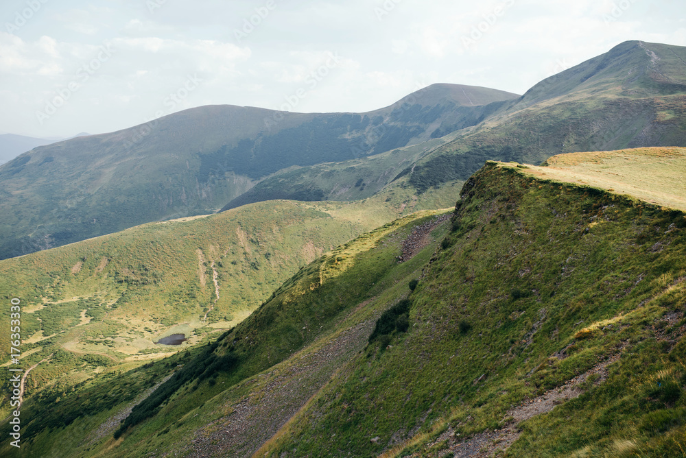 Fototapeta premium The mountain view with the nice sky in the warm sun light