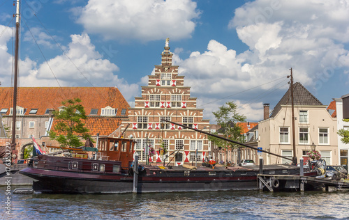 Old ship and historic facade in the center of Leiden photo