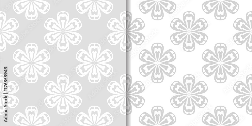 Light gray floral backgrounds. Set of seamless patterns for textile and wallpapers