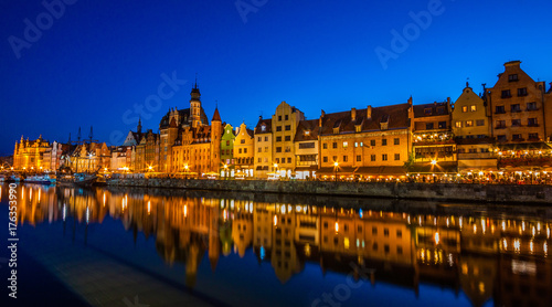 Gdansk old town and famous crane, Polish Zuraw. View from Motlawa river, Poland at romantic sunset, night. © cone88
