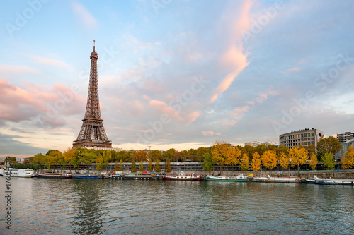 Eiffel tower at dusk in paris with river Seine in the foreground, France