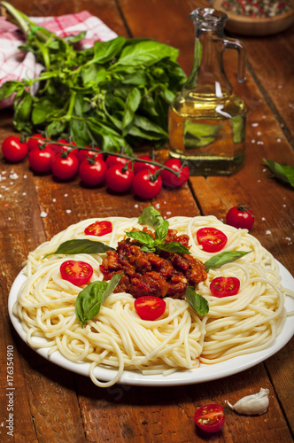 Plate of delicious spaghetti Bolognaise or Bolognese with savory minced beef and tomato sauce.