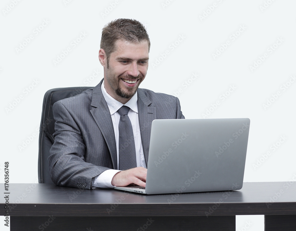 closeup.happy businessman working on laptop, sitting at desk closeup.happy businessman working on laptop, sitting at desk