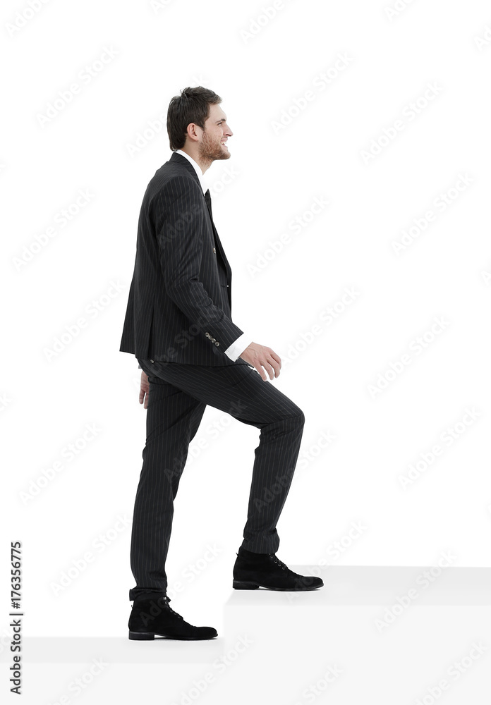 full growth.businessman taking a step forward.isolated on white. full growth.businessman taking a step forward.isolated on white.