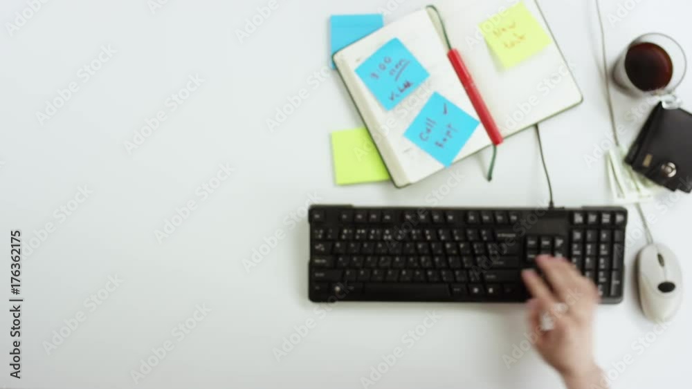 Top down shot of man searching through online shop and calling there by using his smartphone Top down shot of man searching through online shop and calling there by using his smartphone