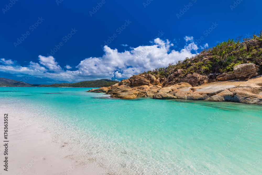 Rocks on Whitehaven Beach with white sand in the Whitsunday Islands, Queensland, Australia