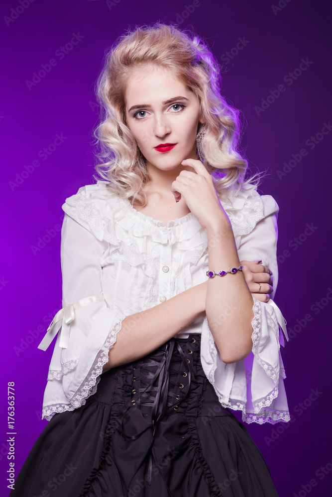 Beautiful, tender, blond woman in a white old blouse. On a purple background. A delightful doll girl.