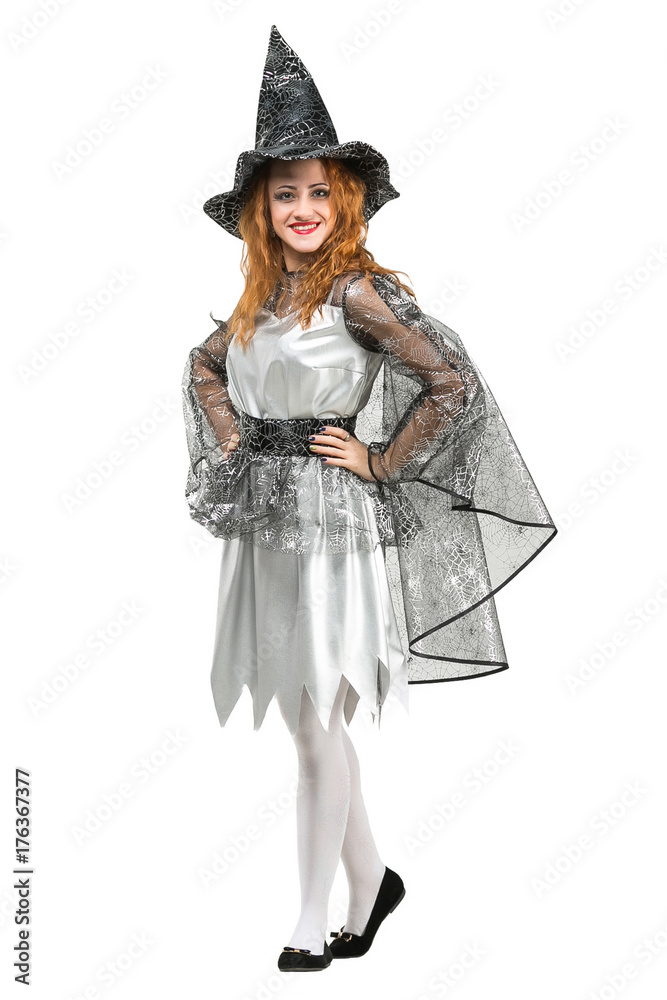 clothes, carnival, all saints day concept. fancy young woman with red hair dressed up like witch with her black pointed hat and mantle, almost all details of her costume are decorated with silver web clothes, carnival, all saints day concept. fancy young woman with red hair dressed up like witch with her black pointed hat and mantle, almost all details of her costume are decorated with silver web