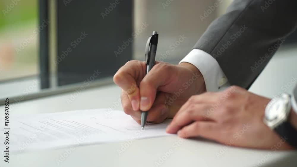 Close up business man signing contract making a deal, classic business Close up business man signing contract making a deal, classic business