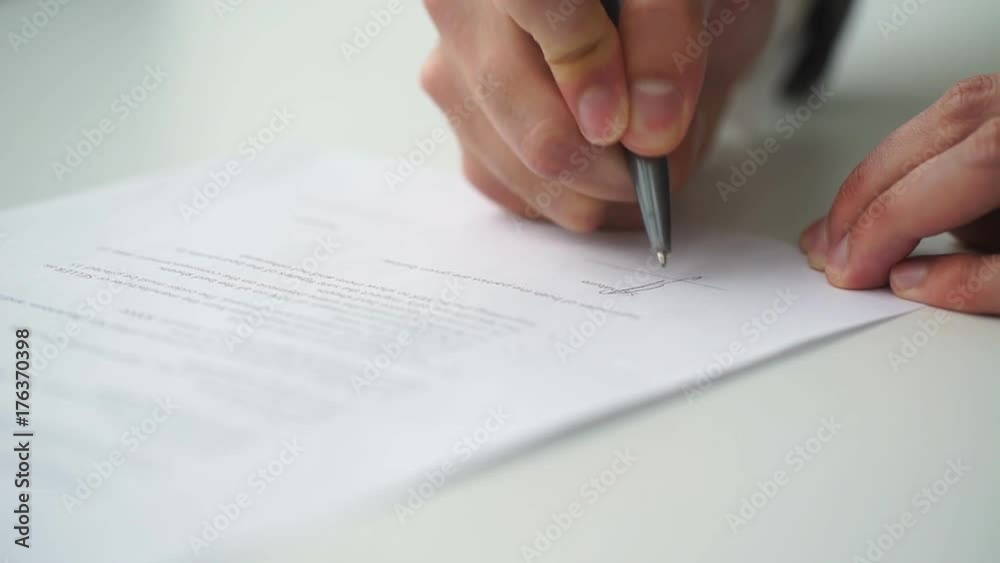 Businessman is signing a contract, business contract details