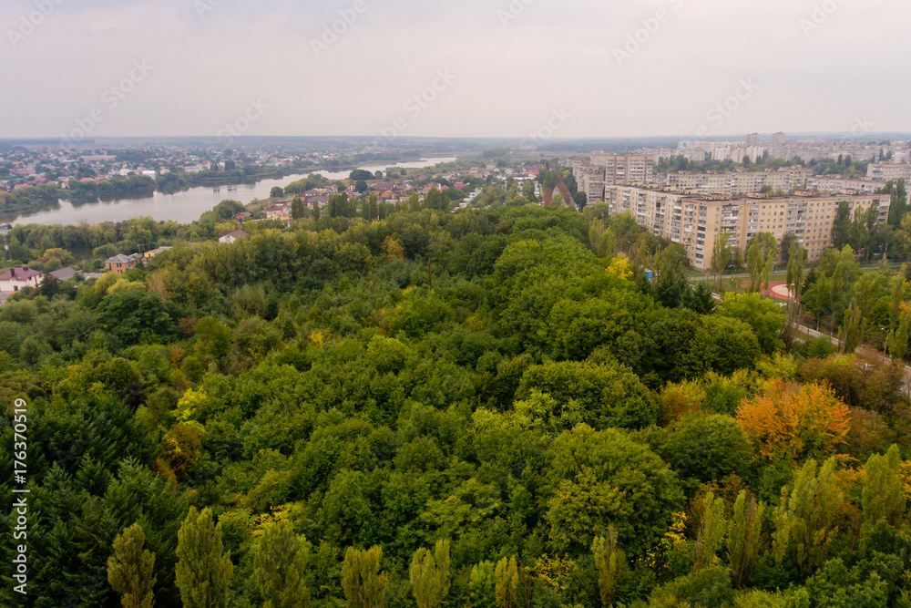 Arial view of a beautiful landscape of a park, a city and a lake.