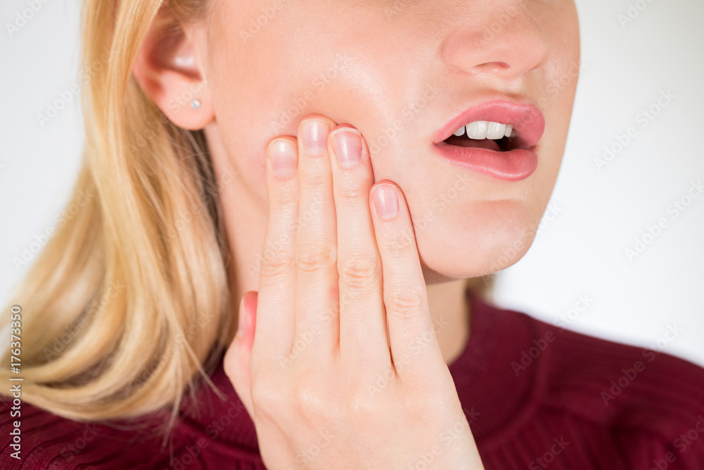 Studio Close Up Of Woman Suffering With Toothache