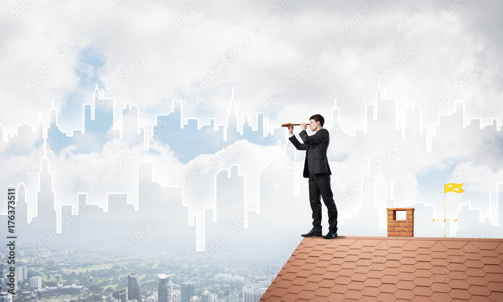 Engineer man standing on roof and looking in spyglass. Mixed media Engineer man standing on roof and looking in spyglass. Mixed media
