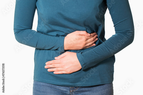 Close Up Of Woman Suffering With Stomach Pain