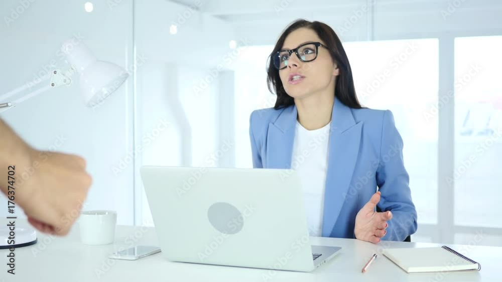 Woman Reacting to Angry Boss at Work Woman Reacting to Angry Boss at Work
