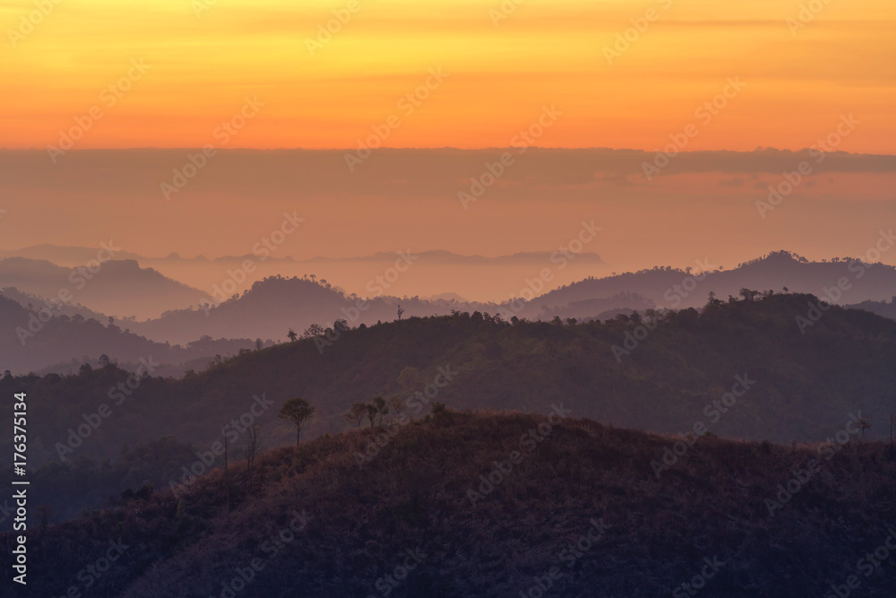 high view sunrise in early morning over  rainforest with  layer mountain in thailand 