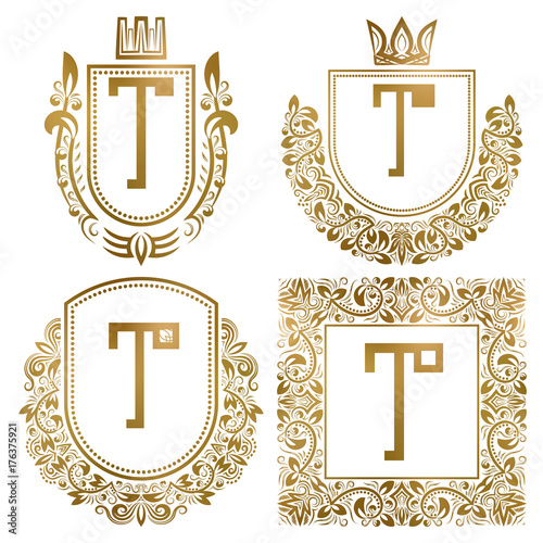 Golden vintage monograms set. Heraldic logos with letter T.