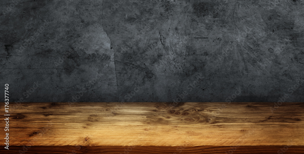 Grey concrete wall with wooden table - obrazy, fototapety, plakaty 