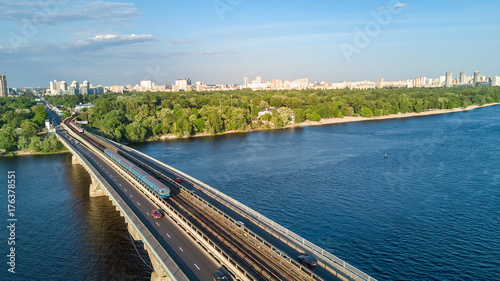 Wallpaper Mural Aerial top view of Metro railway bridge with train and Dnieper river from above, skyline of city of Kiev, Ukraine
 Torontodigital.ca
