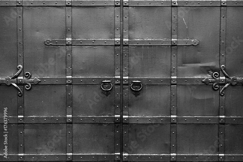 Abstract black and white background with correct geometric proportions. Steel black gates. Symmetrical and isolated.