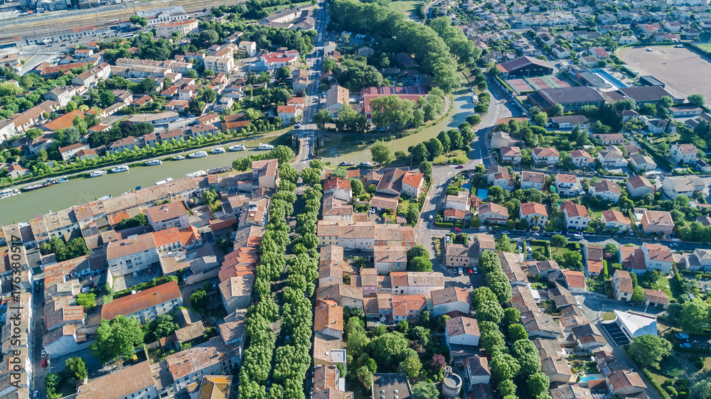 Aerial top view of residential area houses roofs and streets from above, old medieval town background
