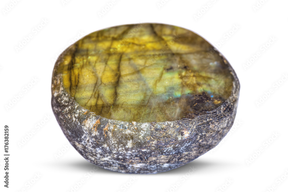 The semi-precious stone Labradorite on one side is polished, on a white background.