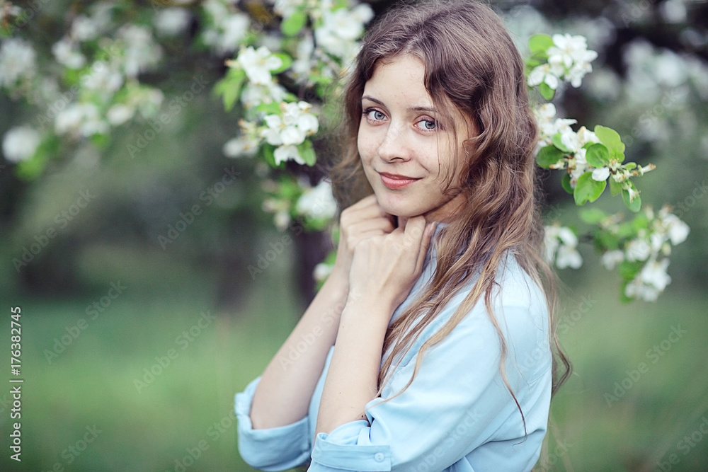 young adult girl enjoys smell of spring flowers apple young adult girl enjoys smell of spring flowers apple