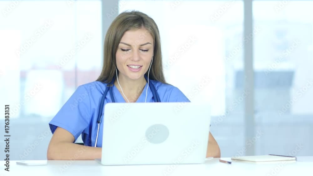 Young Female Doctor Talking with Patient, Online Video Chat on Laptop Young Female Doctor Talking with Patient, Online Video Chat on Laptop
