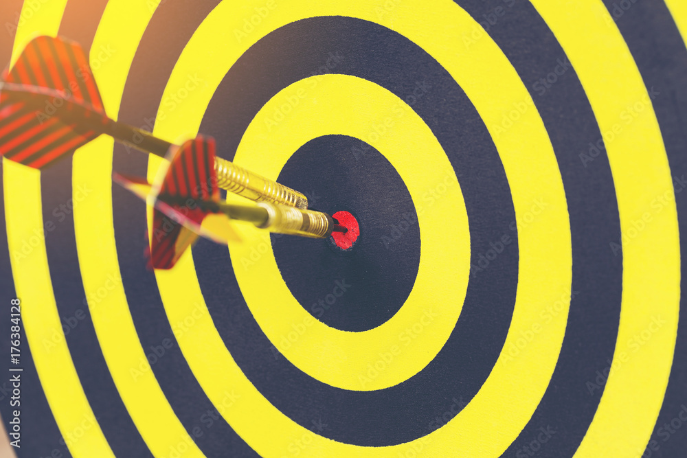 Target dart with arrow background ,metaphor to target marketing or target arrow concept. Target dart with arrow background ,metaphor to target marketing or target arrow concept.
