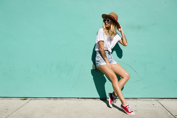 fashionista girl standing in the backstreet.
