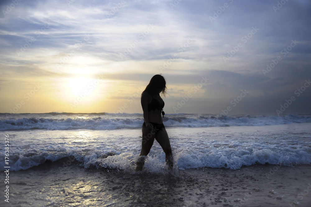 young active woman on sea landscape sunset horizon with amazing sun and dramatic orange sky young active woman on sea landscape sunset horizon with amazing sun and dramatic orange sky