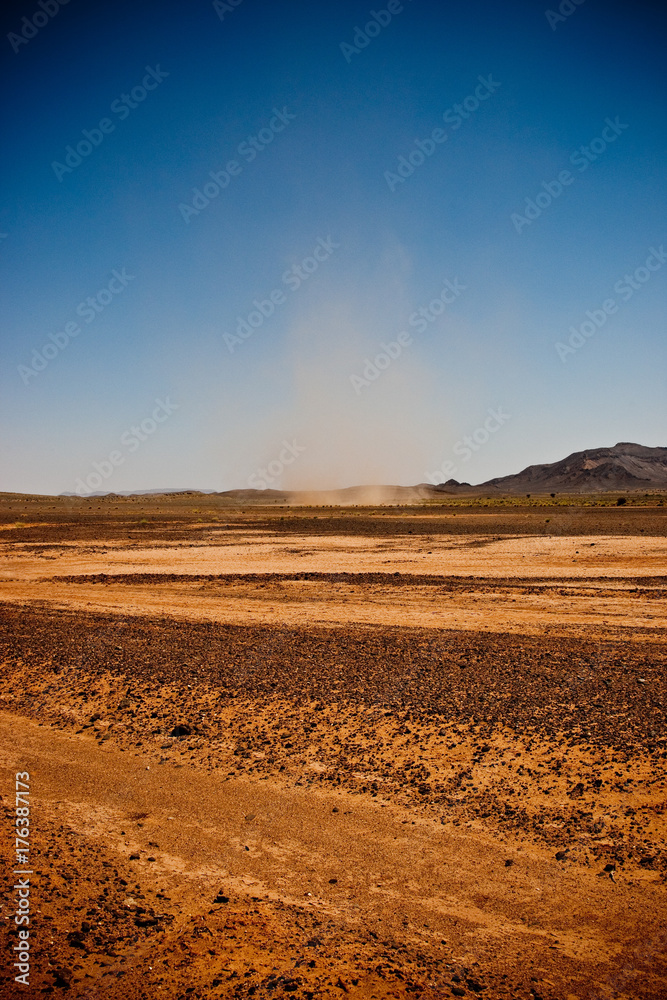 Small tornado arising in the arid desert of Morocco