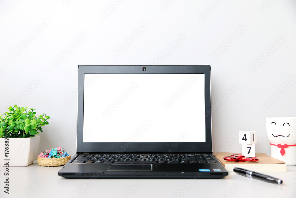Laptop computer White screen with space for your text in modern office Laptop computer White screen with space for your text in modern office