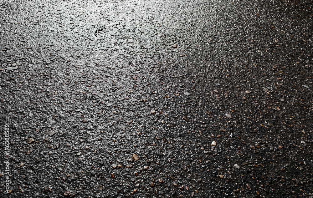 Wet asphalt road after the rain. Asphalt background. Asphalt
