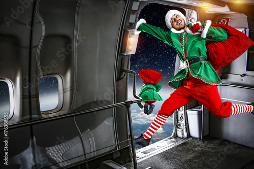 Fototapeta Naklejka Na Ścianę i Meble -  green elf in airplane jumpping 